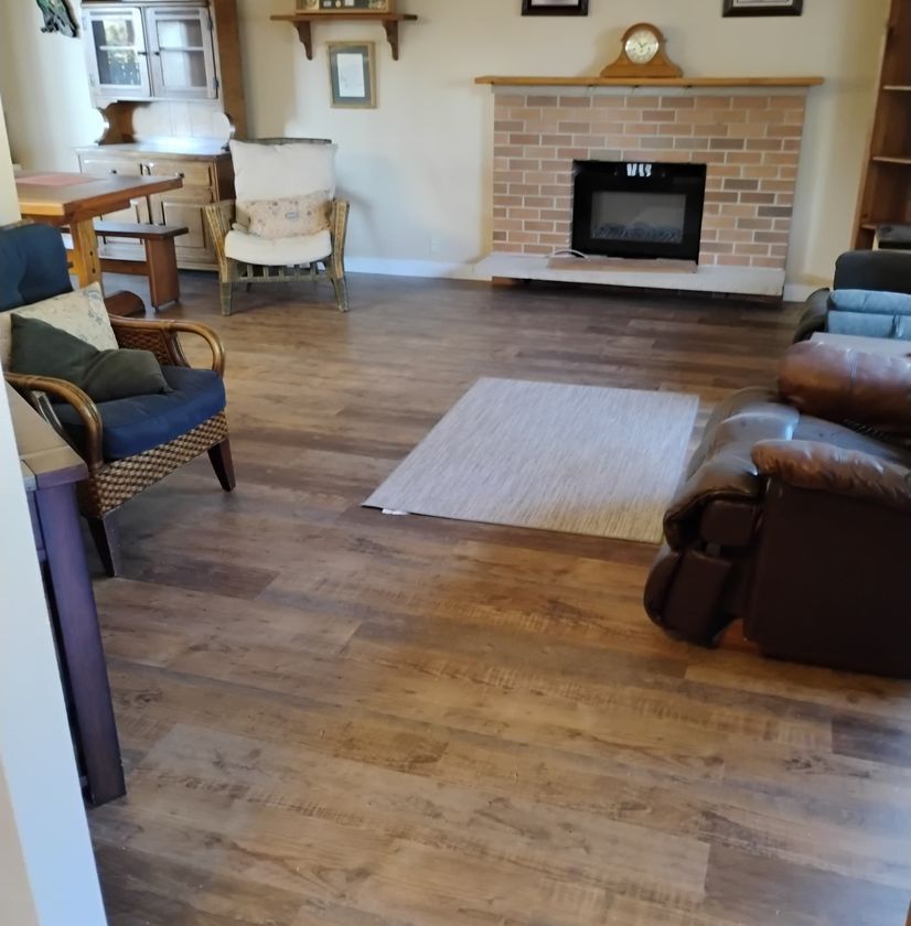 Living room renovation featuring hardwood flooring